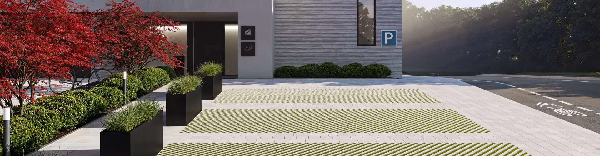 Trávniková dlažba Verso na optimálne vsakovanie dažďovej vody v kombinácii s kombi dlažbou Arret B20 VG4 pre bezbariérové chodníky – Friedl Steinwerke Vkusne navrhnutá parkovacia plocha s vsakovacou a bežnou dlažbou od Friedl Steinwerke